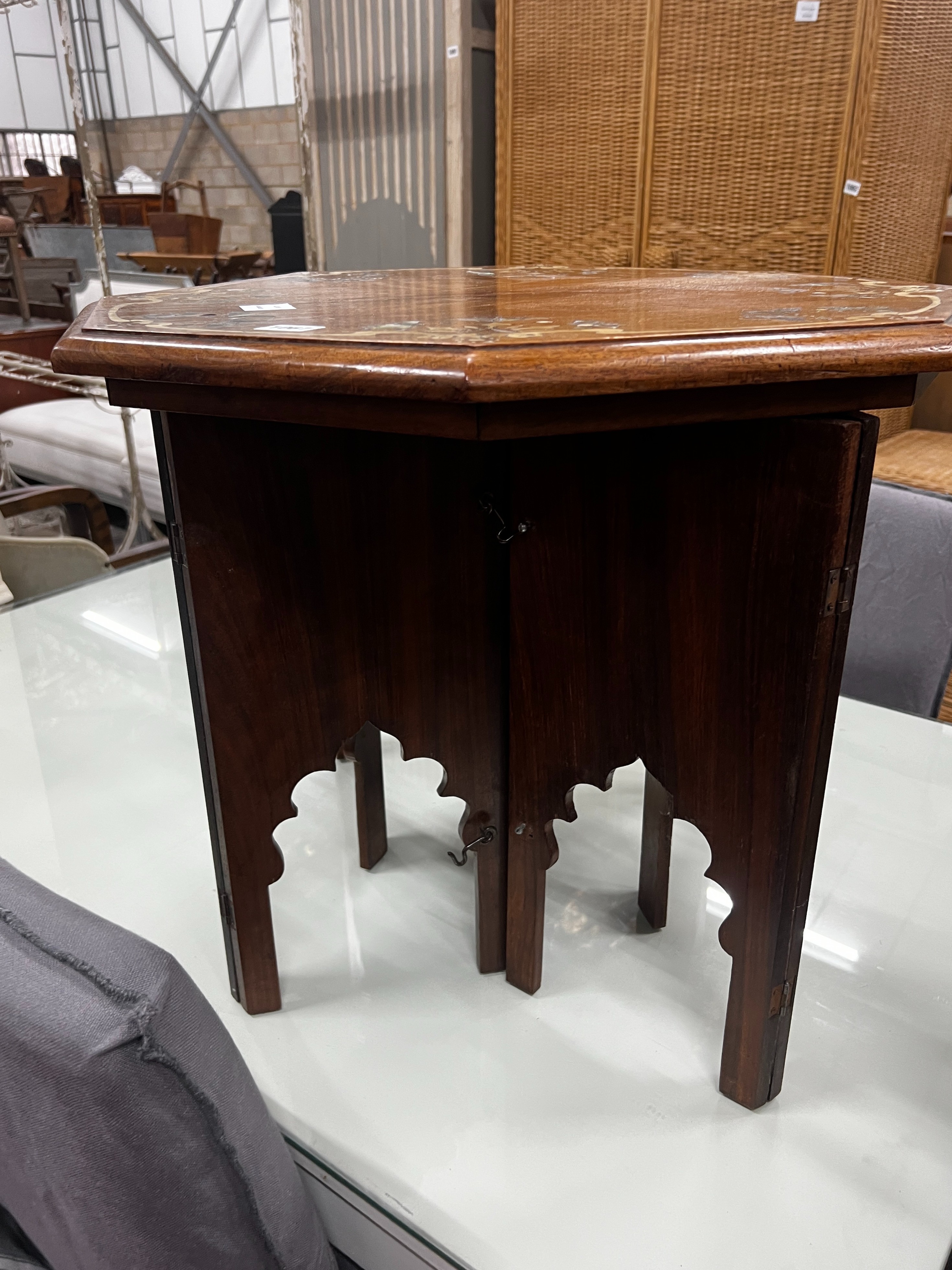 An Indian “Mysore Arts & Crafts” Abalone inlaid octagonal hardwood Moorish style table with folding stand, width 60cm, height 50cm